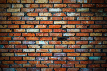 background texture brick wall of old red brick with a vignette