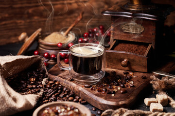 Pouring coffee into a cup on a wooden vintage table