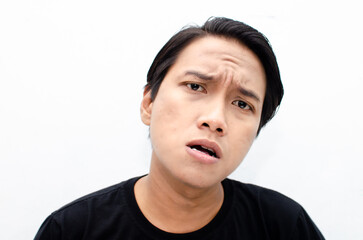 Headshot of asian man with angry, mad, depressive and furious face expression looking for fight...