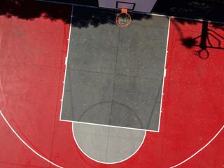 aerial view of a red painted basketball court