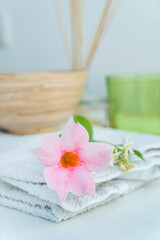 Obraz na płótnie Canvas spa concept, fresh flowers and aroma diffuser