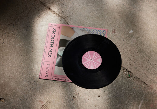 Vinyl Record With Sleeve Mockup on a Concrete Background