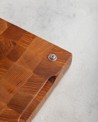 Wooden cutting board in the kitchen on a light background
