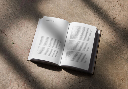  Open Hardcover Book Mockup on a Concrete Background With Shadows