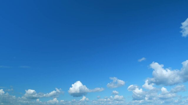 Summer fluffy rolling clouds, windy weather in daytime. Time lapse.
