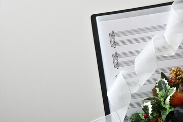 Choral christmas performance concept background with sheet music on table