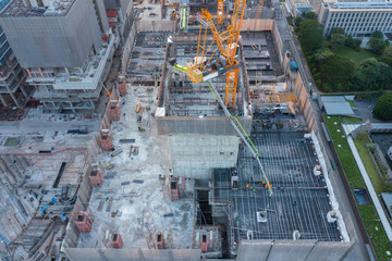 aerial view of construction site with tower crane urban construction Rush hour of concrete pouring
