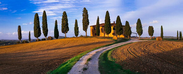 Romantic scenic Tuscany countryside. Iconic view of cypresses of famous valley Val d'Orcia. Italy,...