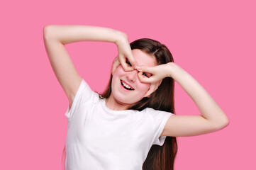 Funny girl making fake comic glasses with her fingers