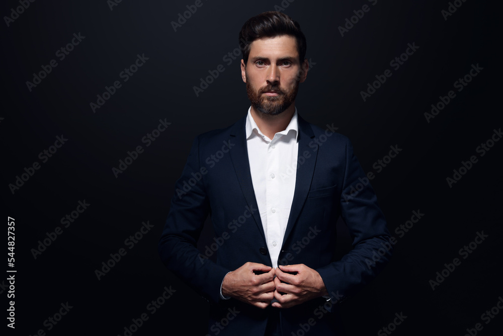 Wall mural portrait of handsome bearded man on black background