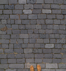 Old paving slabs with shoes