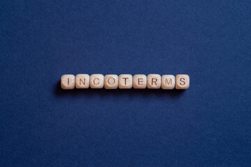 Incoterms - word concept on cubes