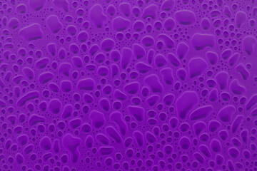 Colorful abstract pattern of round bubbles or droplets as cells under microscopy in saturated...