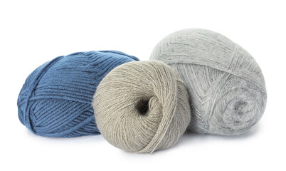 Different balls of woolen knitting yarns on white background