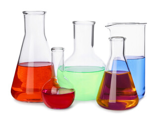 Different laboratory glassware with colorful liquids on white background