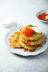 Homemade latkes with red caviar