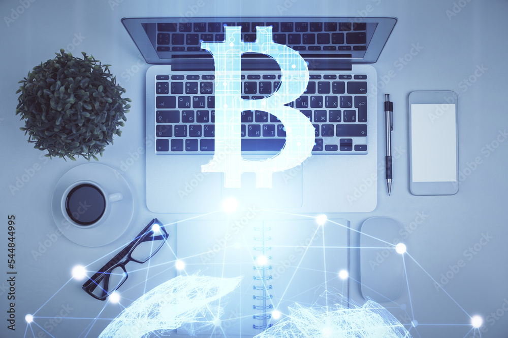 Poster Blockchain theme hologram drawings over computer on the desktop background. Top view. Multi exposure. Concept of cryptoeconomy.