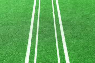 Obraz premium Green field ground with white lines. Outdoor