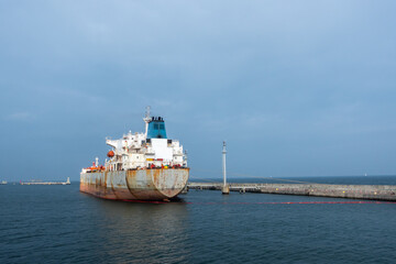 Tanker moored in the port for the duration of the crude oil unloading operation. Photo taken in...