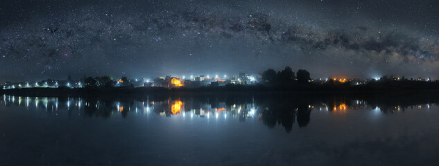 Starry night sky over the lake