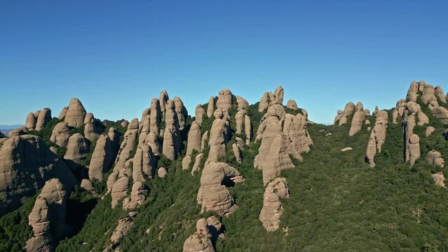 The mountains of Montserrat are needle-shaped, the rocks have been worn in this way because they were once surrounded by water