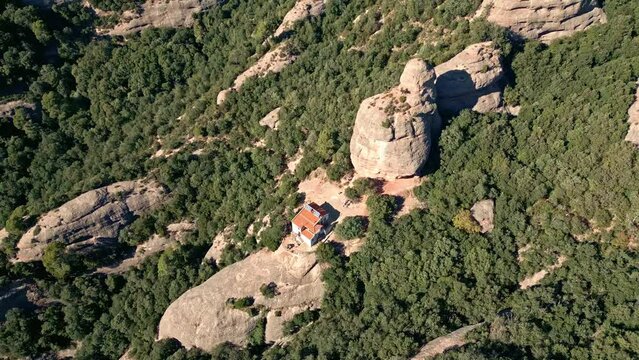 isolated refuge in the middle of the mountains of montserrat, surrounded by large stones in the form of needles