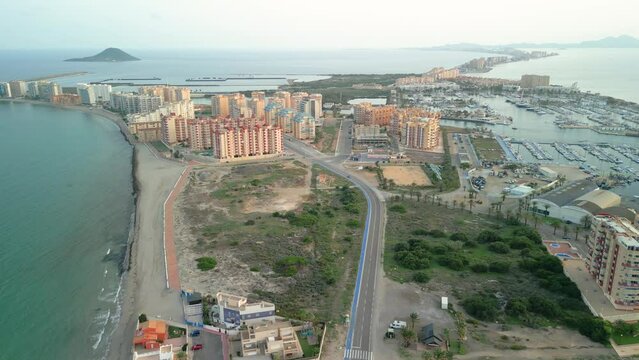 Aerial image of the city of la manga, in La Manga del Mar Menor Murcia impressive view of the buildings and beaches marina golden hour