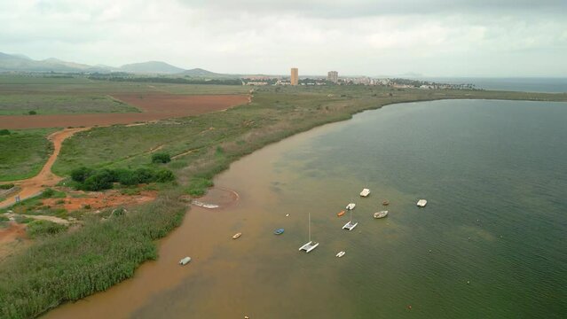 Camping La Manga in Murcia aerial images of the beach small fishing boats on the lagoon