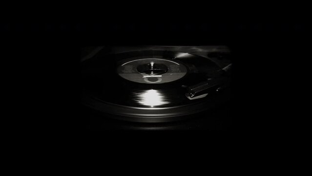 45 rpm record player with spinning record.