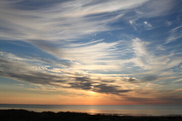 Fototapeta na wymiar Beautiful evening sky above the sea before the sunset. Selective focus