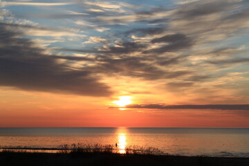 Fototapeta na wymiar Wonderful sky during the sunset above the sea. Selective focus