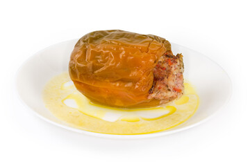 Stuffed bell pepper on the dish on a white background