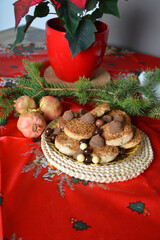 Christmas cookies on a plate on a decorated table. Dessert of cookies plate perfect for celebrating Christmas.