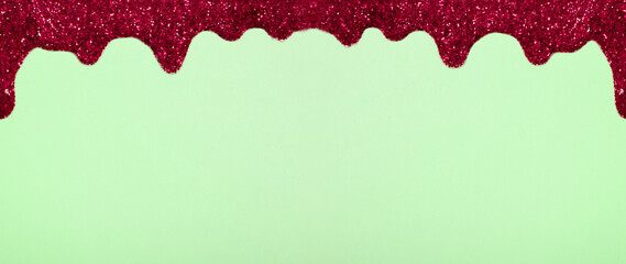 Banner with shiny border made of glitter gel on a colored background. Christmas background with copy space
