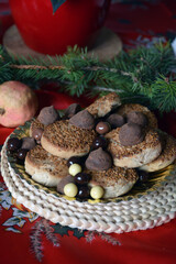 Christmas cookies on a plate on a decorated table. Dessert of cookies plate perfect for celebrating Christmas.