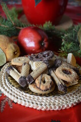 Christmas cookies on a plate on a decorated table. Dessert of cookies plate perfect for celebrating Christmas.