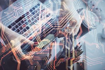 Double exposure of woman hands typing on computer and technology theme drawing. High Tech concept.