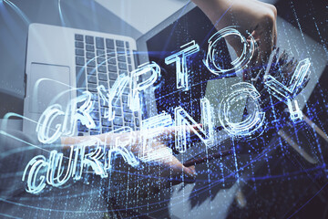 Double exposure of woman hands typing on computer and crypto market theme hologram drawing. Blockchain concept.