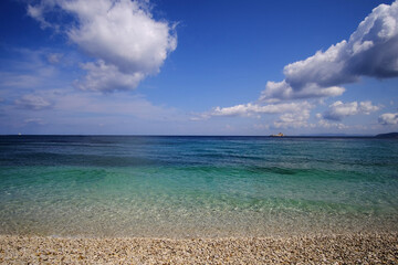 beach with blue sky and clouds