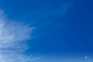 Picturesque blue sky with white clouds on sunny day