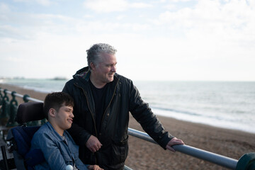 Portrait of father and son by the sea