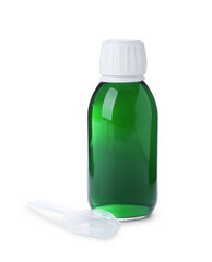 Bottle of syrup with plastic spoon on white background. Cough and cold medicine