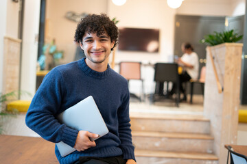 Portrait of smiling businessman in office