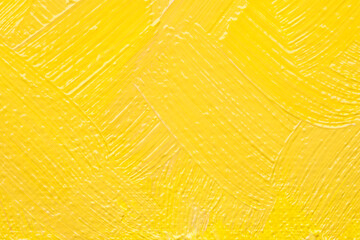 Beautiful strokes of yellow oil paint as background, closeup