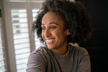 Portrait of smiling woman at home