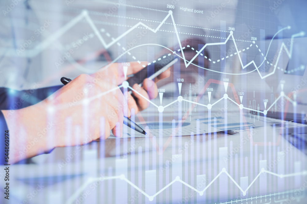 Aufkleber double exposure of man's hands holding and using a phone and financial chart drawing. market analysi
