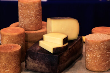 Handcrafted cheese on a farm fair. Selective focus