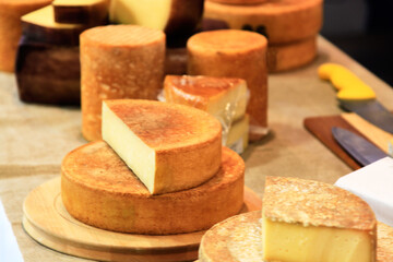 Handcrafted cheese on a farm fair. Selective focus