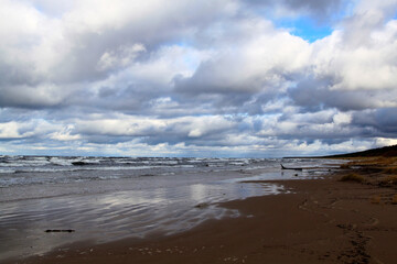 Sky full of clouds above the wavy sea. Selective focus.