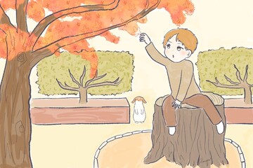 紅葉したもみじの葉っぱを取ろうとするかわいい子ども(男の子)